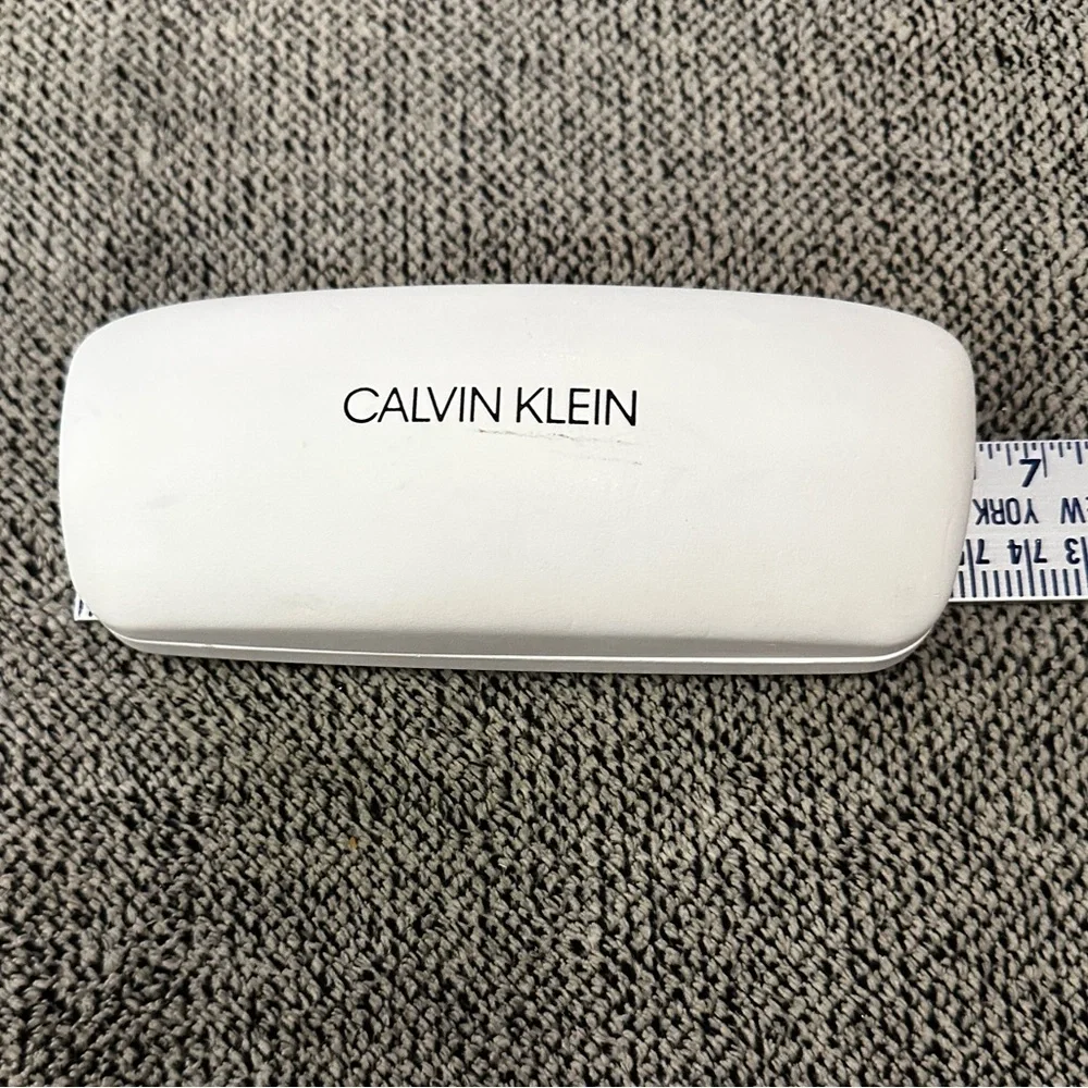 Calvin Klein youth eyeglasses and case.